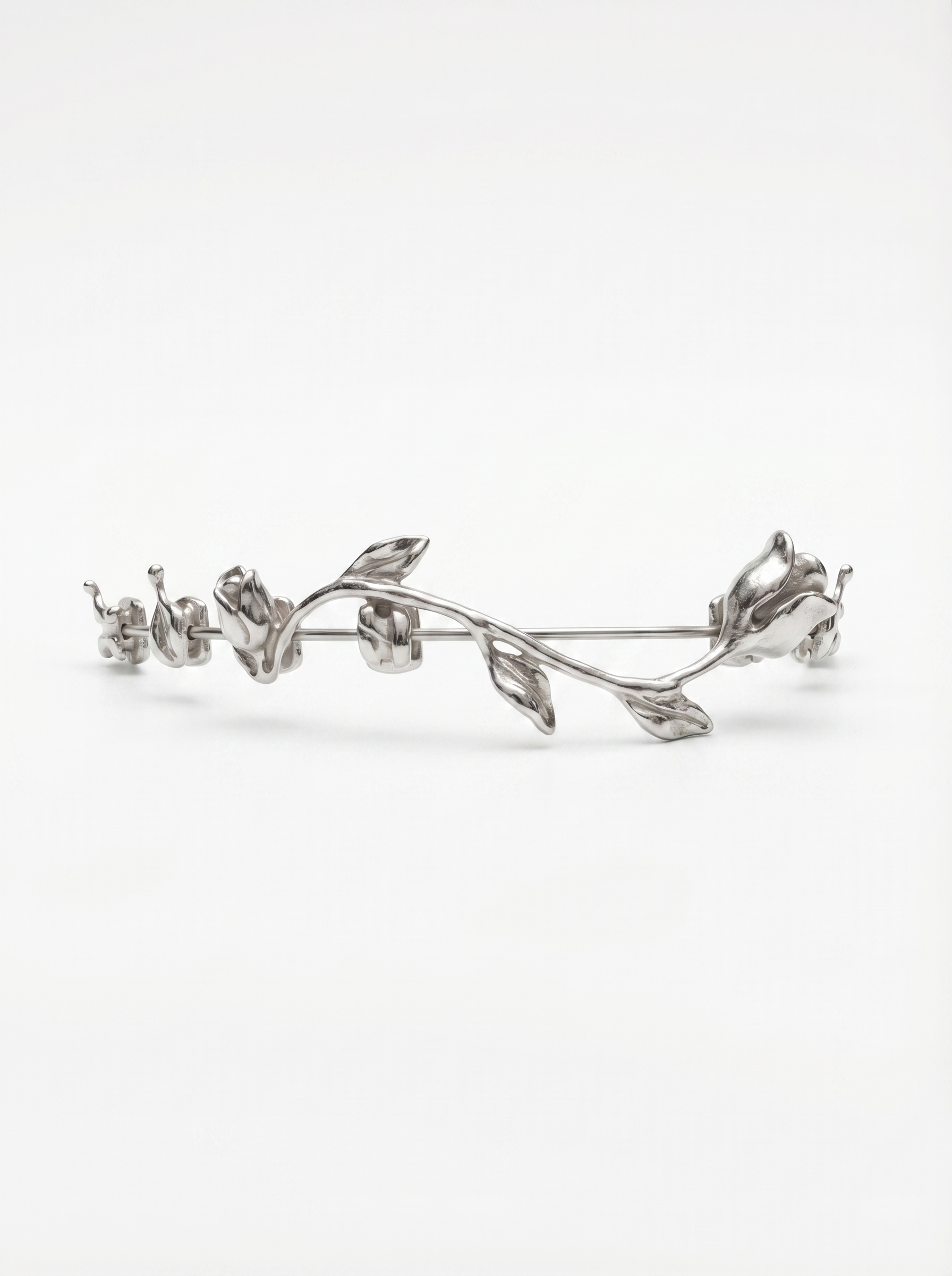 Woman in white dress and gold earrings walking down runway